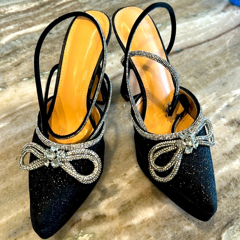 black glitter closed toe shoes, with silver rhinestone detail.